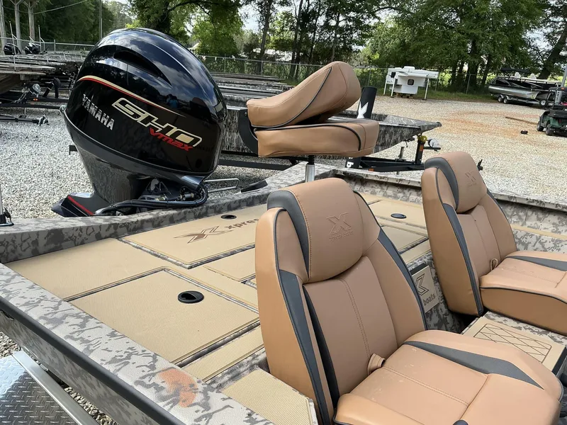 Slide: The Image of 2025 Xpress Hyper-Lift Bass Series boat with Yamaha engine and tan seating. - 5