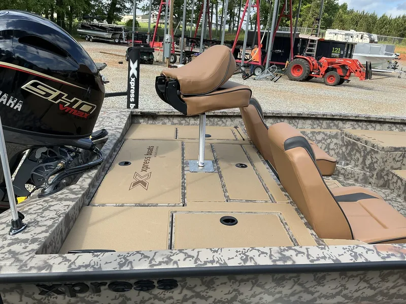 Slide: The Image of 2025 Xpress Hyper-Lift Bass Series boat with Yamaha engine, featuring tan seating and camo design. - 8