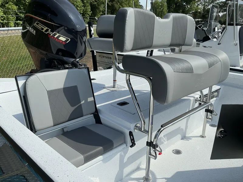 Slide: The Image of 2025 Xpress Hyper-Lift Series H22B boat interior with Yamaha engine and cushioned seating. - 10