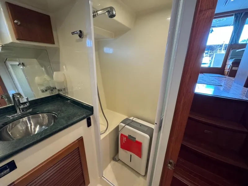 Slide: The Image of Bathroom in 2010 North Pacific 43 Pilothouse yacht with shower and sink. - 22