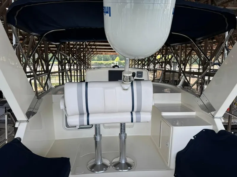 Slide: The Image of 2010 North Pacific 43 Pilothouse yacht interior with seating and navigation equipment. - 25