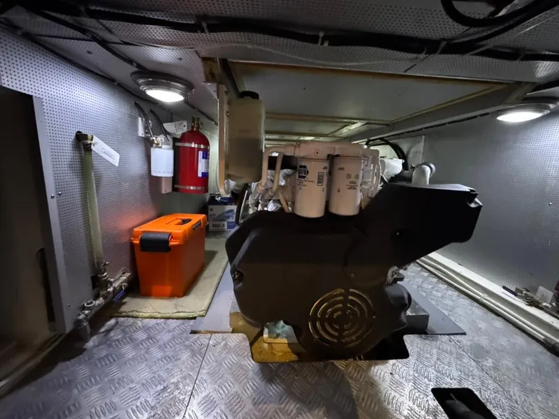 Slide: The Image of Engine room of 2010 North Pacific 43 Pilothouse with equipment and fire extinguisher. - 29