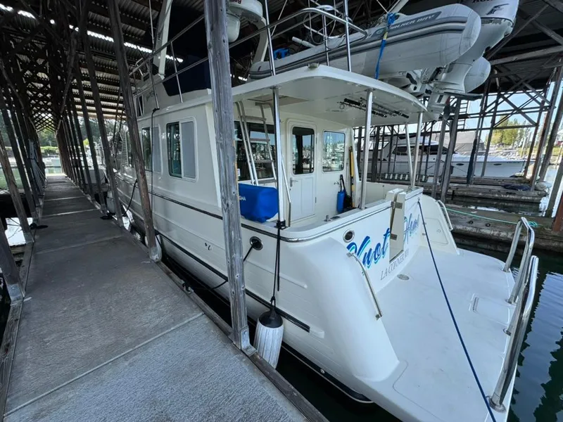Slide: The Image of North Pacific 43 Pilothouse 2010 docked in a covered marina. - 3