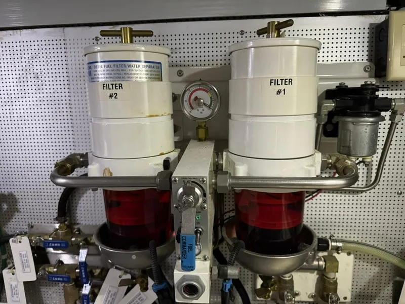 Slide: The Image of Fuel filters in a 2010 North Pacific 43 Pilothouse engine room. - 38