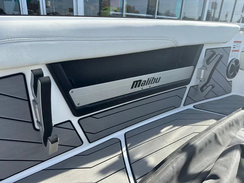 Slide: The Image of 2017 Malibu Response TXi boat interior with sleek design and branded detailing. - 11