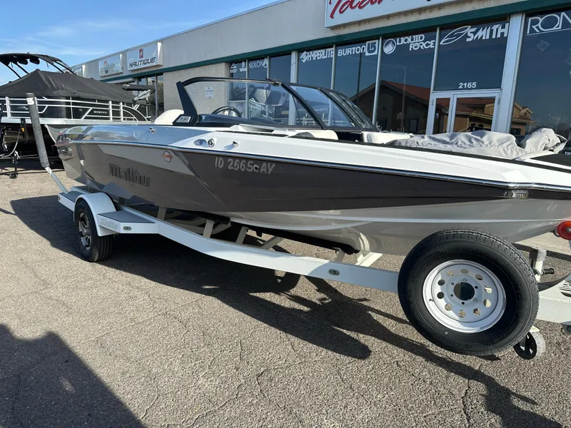Slide: The Image of 2017 Malibu Response TXi boat on trailer outside a dealership. - 5