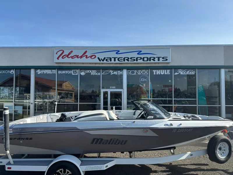 Slide: The Image of 2017 Malibu Response TXi boat outside Idaho Watersports store. - 7