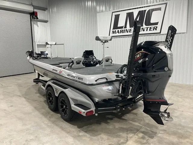 Slide: The Image of 2025 Skeeter FXR21L bass boat in showroom, featuring Yamaha outboard motor. - 3