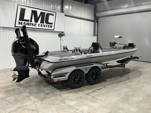 Slide: The Image of 2025 Skeeter FXR21L boat in showroom, featuring dual axles and Yamaha engine. - 8