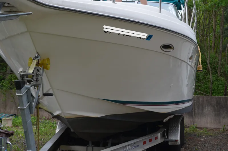 Slide: The Image of 1996 Rinker 300 Fiesta Vee boat on trailer, side view, outdoors. - 10