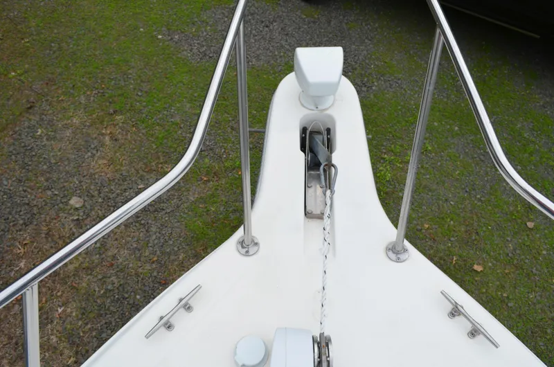 Slide: The Image of Bow of 1996 Rinker 300 Fiesta Vee with anchor and railing. - 13