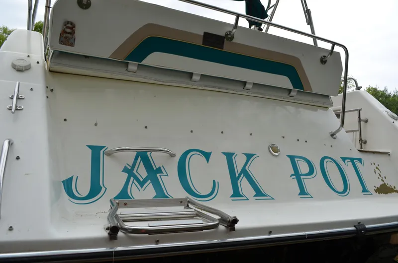 Slide: The Image of 1996 Rinker 300 Fiesta Vee boat with "Jack Pot" name on the stern. - 16