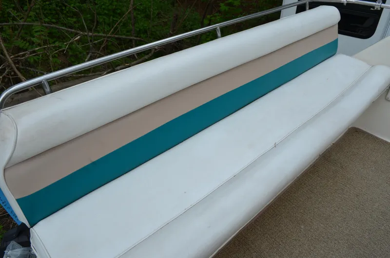 Slide: The Image of White and teal seating on 1996 Rinker 300 Fiesta Vee boat. - 20