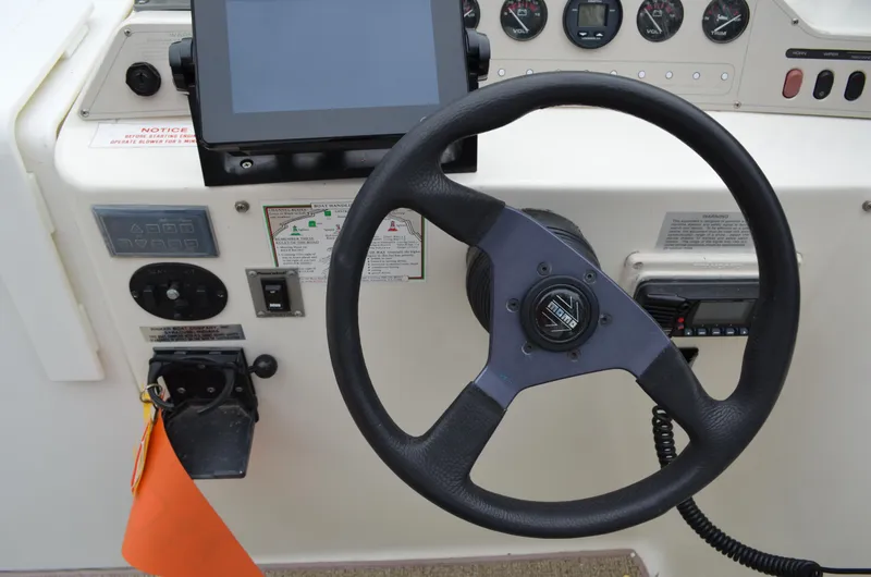 Slide: The Image of Steering wheel and dashboard of 1996 Rinker 300 Fiesta Vee boat. - 25