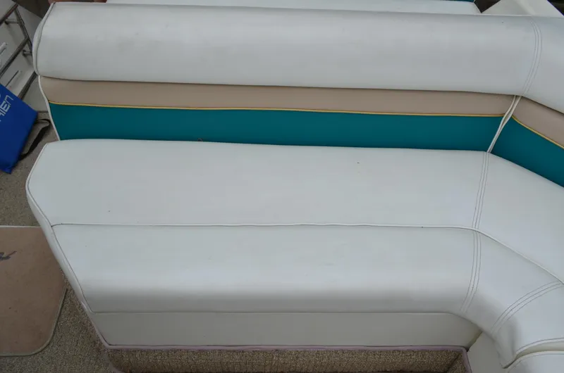 Slide: The Image of White and teal seating on 1996 Rinker 300 Fiesta Vee boat. - 29