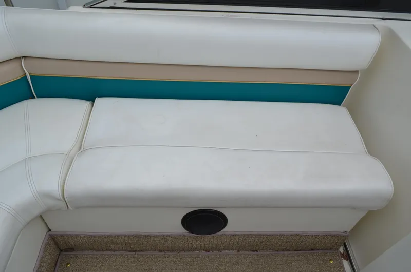 Slide: The Image of White and teal seating on a 1996 Rinker 300 Fiesta Vee boat. - 30