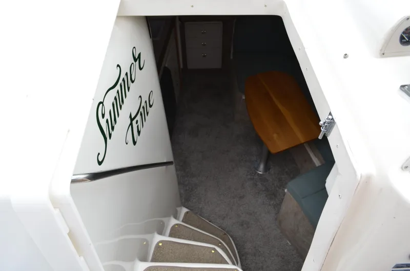 Slide: The Image of Interior view of 1996 Rinker 300 Fiesta Vee boat, featuring "Summer Time" text. - 31