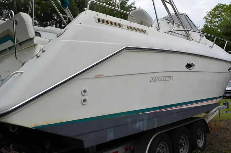 Slide: The Image of 1996 Rinker 300 Fiesta Vee boat on trailer, side view. - 8