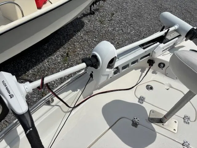 Slide: The Image of 2020 Key West 1720 Sportsman boat with Minn Kota trolling motor on gravel surface. - 10