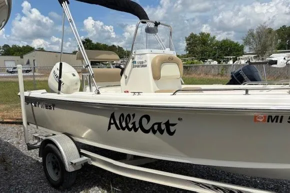 Slide: The Image of 2020 Key West 1720 Sportsman boat named "AlliCat" on a trailer, outdoors. - 2