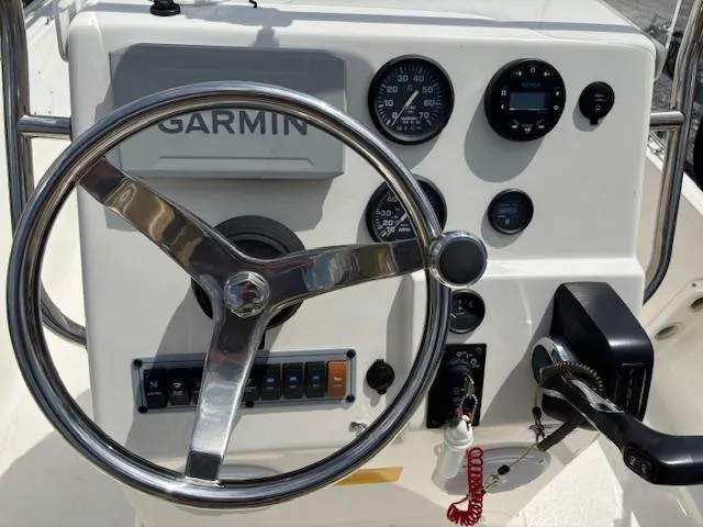 Slide: The Image of 2020 Key West 1720 Sportsman boat dashboard with Garmin navigation system and steering wheel. - 4