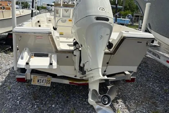 Slide: The Image of 2020 Key West 1720 Sportsman boat with outboard motor, parked on gravel. - 5