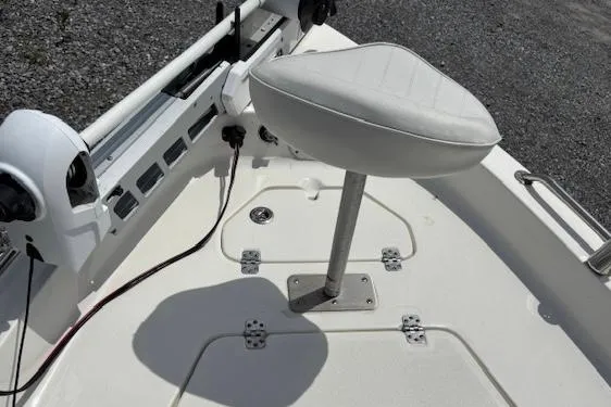 Slide: The Image of 2020 Key West 1720 Sportsman boat interior with white seat and fishing rod holders. - 7