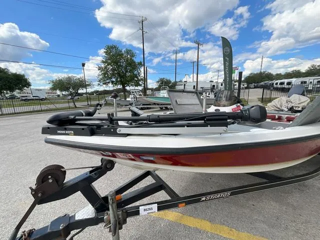 Slide: The Image of Top view of a 2007 Stratos 176XT boat with red and gray interior. - 2