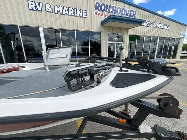 Slide: The Image of 2007 Stratos 176XT boat with red and gray seating on a trailer. - 3