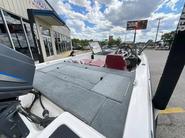 Slide: The Image of 2007 Stratos 176XT boat with motor, parked outside dealership under cloudy sky. - 8