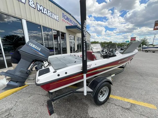 Slide: The Image of 2007 Stratos 176XT boat with Yamaha motor, parked outside a marine store. - 9