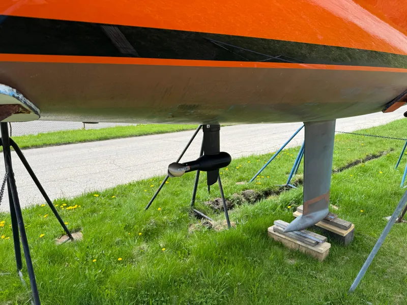 Slide: The Image of 2025 Saffier 24 Lite sailboat hull and keel on grass with supports. - 3