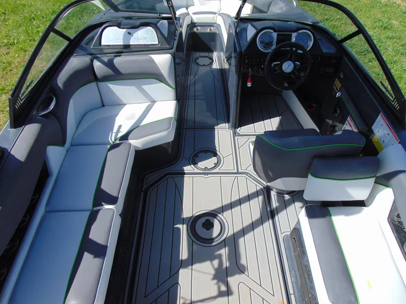 Slide: The Image of 2018 Moomba Mondo boat interior with sleek seating and modern dashboard design. - 17