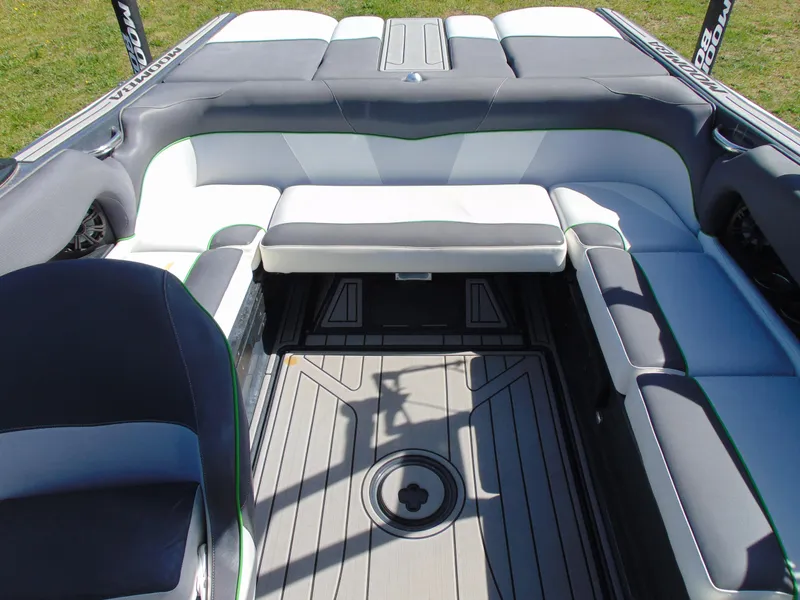 Slide: The Image of 2018 Moomba Mondo boat interior with gray and white seating and deck. - 21