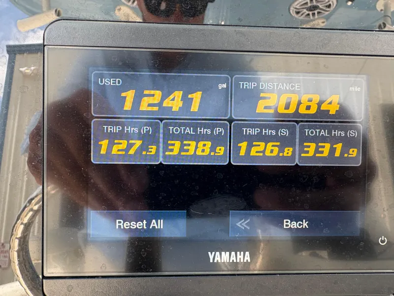 Slide: The Image of Yamaha display showing fuel usage and trip data for 2022 Cobia 301 Center Console. - 10