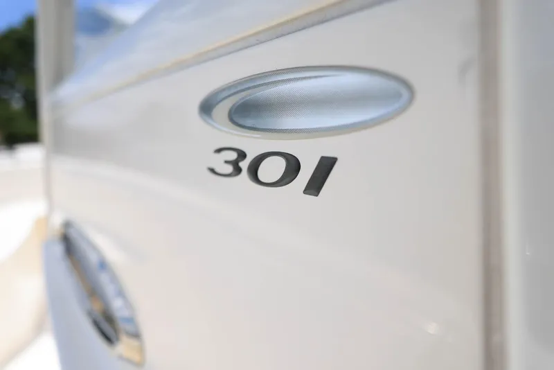 Slide: The Image of 2022 Cobia 301 Center Console boat emblem close-up. - 14