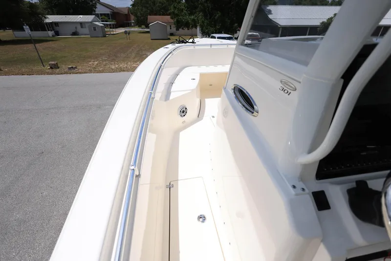 Slide: The Image of 2022 Cobia 301 Center Console boat deck with sleek design and spacious layout. - 15