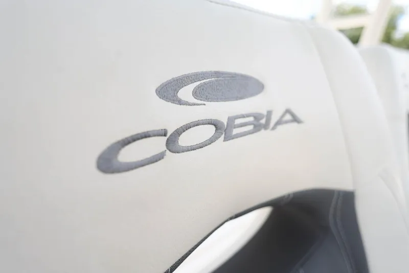 Slide: The Image of 2022 Cobia 301 Center Console logo on boat seat upholstery. - 24
