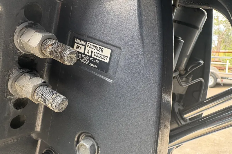 Slide: The Image of Close-up of Yamaha F300XSB engine on 2022 Cobia 301 Center Console boat. - 36