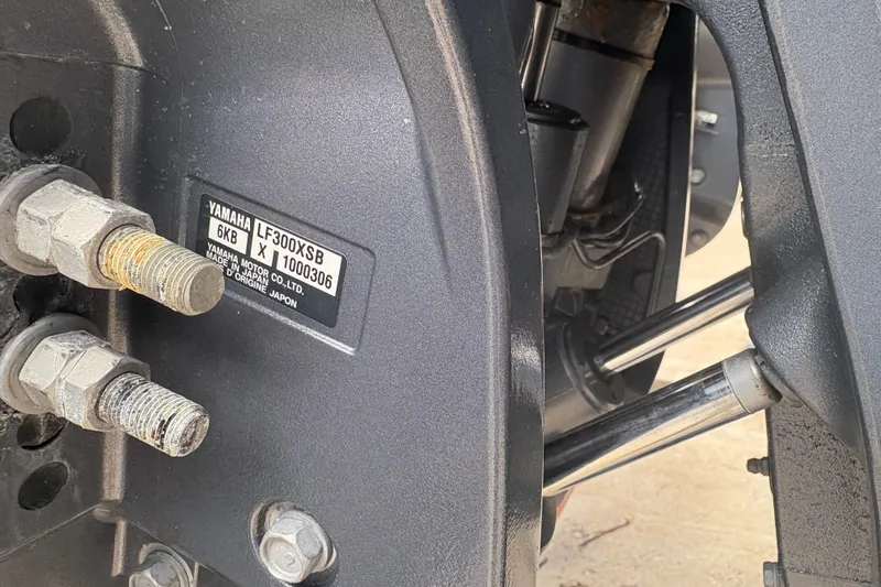 Slide: The Image of Close-up of Yamaha LF300XSB engine part on 2022 Cobia 301 Center Console boat. - 37