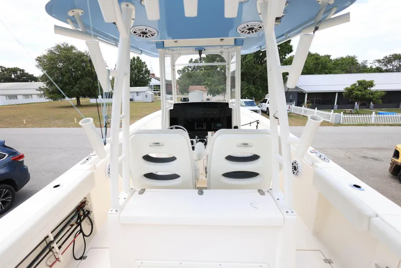Slide: The Image of 2022 Cobia 301 Center Console boat interior with dual seats and steering console. - 9