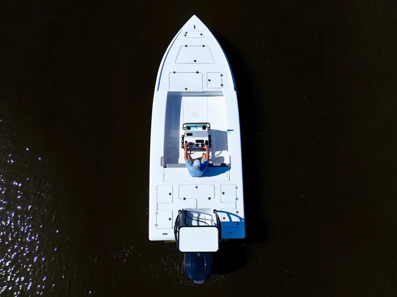 Slide: The Image of Overhead view of 2025 Action Craft 20 Flats boat on dark water. - 10