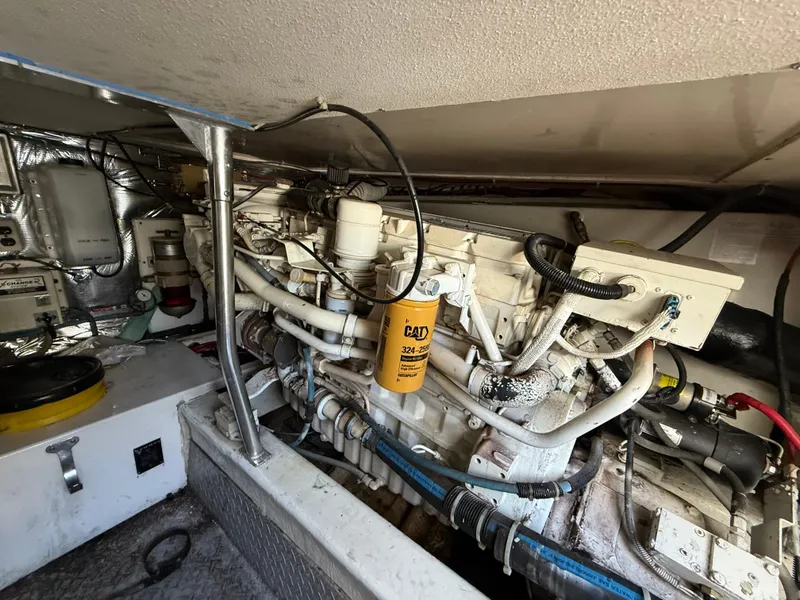Slide: The Image of Engine room of a 1999 Ocean Yachts 40 Super Sport, showcasing mechanical components. - 20
