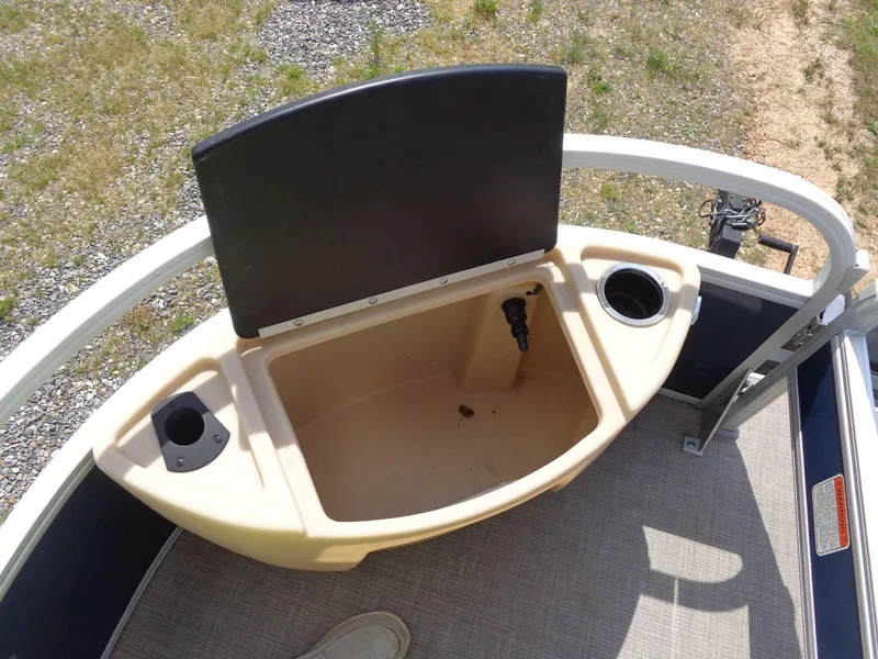 Slide: The Image of 2019 Sun Tracker Fishin' Barge 22 DLX livewell with cup holders on deck. - 12
