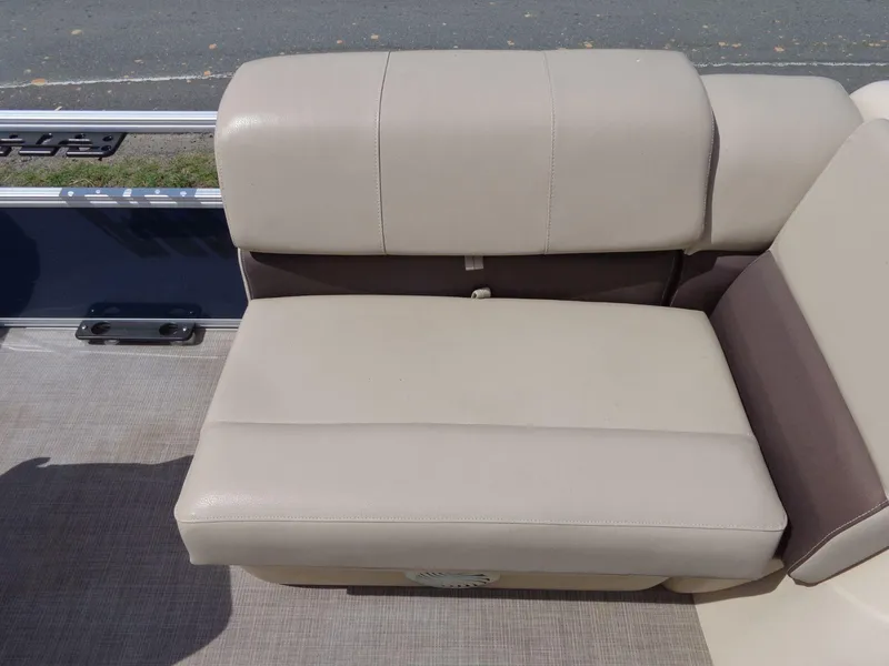 Slide: The Image of 2019 Sun Tracker Fishin' Barge 22 DLX beige seating, outdoor setting. - 17
