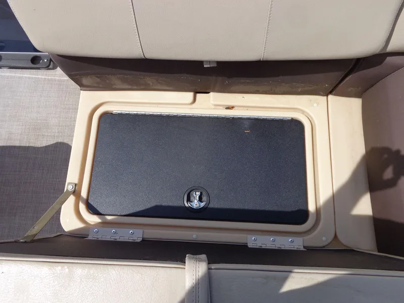 Slide: The Image of Storage compartment on a 2019 Sun Tracker Fishin' Barge 22 DLX boat seat. - 18