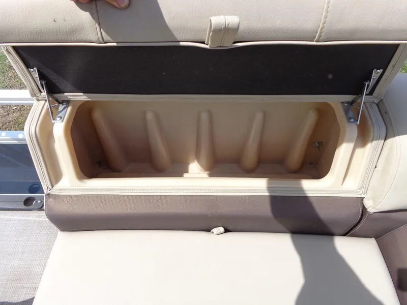 Slide: The Image of Open storage compartment on 2019 Sun Tracker Fishin' Barge 22 DLX boat seat. - 20