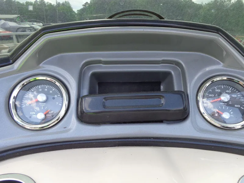 Slide: The Image of Dashboard of 2019 Sun Tracker Fishin' Barge 22 DLX with gauges and controls. - 34