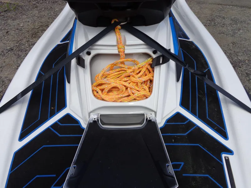 Slide: The Image of 2019 Yamaha FX Cruiser HO storage compartment with orange rope and black-blue deck design. - 15