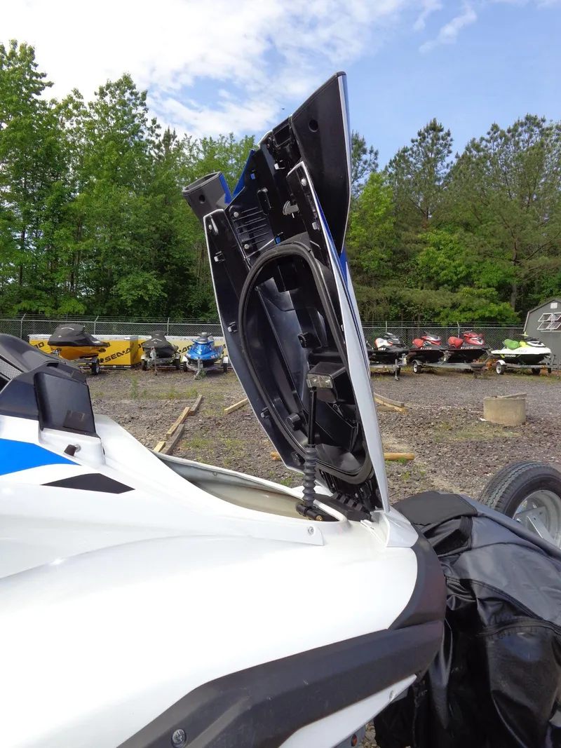 Slide: The Image of 2019 Yamaha FX Cruiser HO with open storage compartment, surrounded by trees and other watercraft. - 27